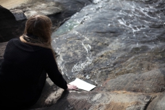 Filmstill of the performance "Male den sjø ", Hardangerfjord, KH Messen, Norway (2019). Film, edit and photo by Lucia Veronesi, Italy